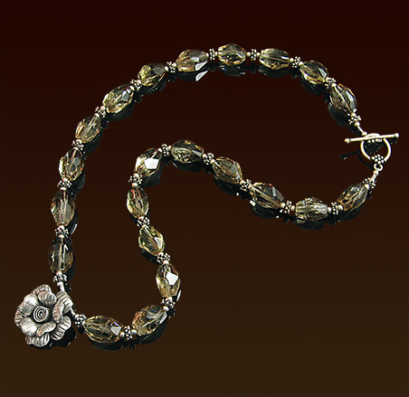 Faceted lemon quartz stones with dark brown inclusions, Hill Tribe silver pendant and toggle clasp