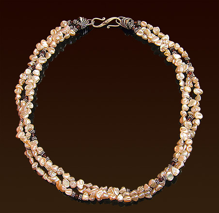 Triple strand apricot freshwater pearls necklace, swarovski crystal and Balinese silver accents, sterling clasp