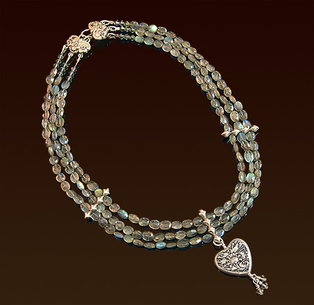 Three strands labradoride necklace, embossed sterling clasp, repousse' heart pendant with swarovski crystals