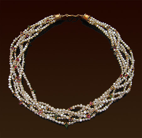 Six strands white freshwater pearls necklace with turmaline gemstones, vermeil accent spacers and "S" clasp