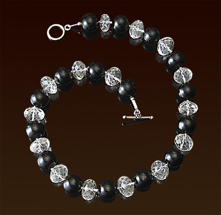 Faceted rock crystal and round black onyx pearls necklace, sterling toggle clasp