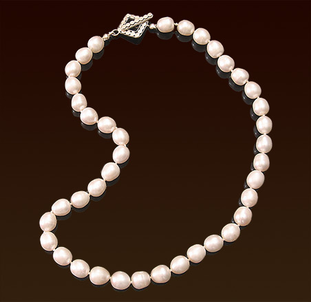 White freshwater pearls necklace, knotted on silk thread, sterling toggle clasp